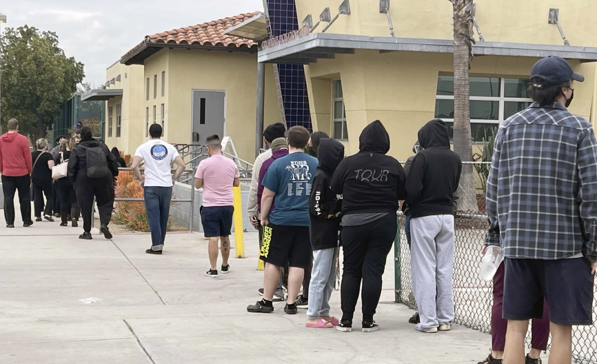 Holidays and omicron lead to long lines at testing sites
